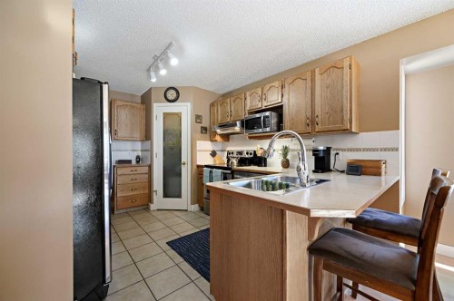 162 West Creek Bay, Chestermere, AB - Indoor Photo Showing Kitchen With Double Sink