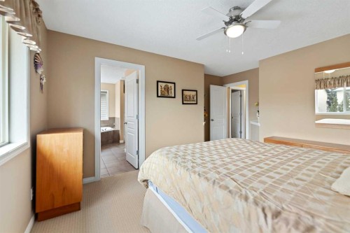 43 Cougarstone Court Sw, Calgary, AB - Indoor Photo Showing Bedroom