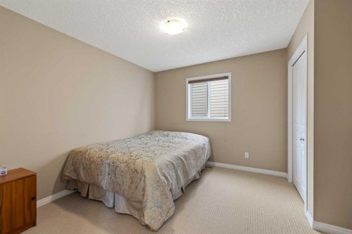 43 Cougarstone Court Sw, Calgary, AB - Indoor Photo Showing Bedroom