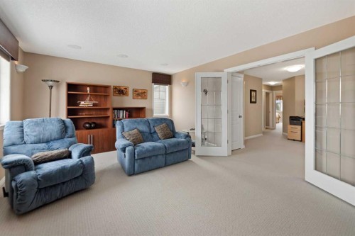 43 Cougarstone Court Sw, Calgary, AB - Indoor Photo Showing Living Room