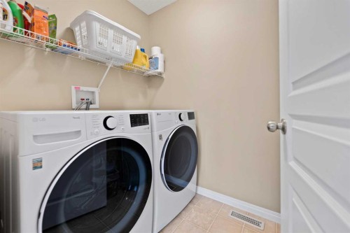43 Cougarstone Court Sw, Calgary, AB - Indoor Photo Showing Laundry Room