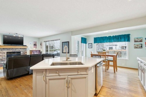 304 Mt. Brewster Circle Se, Calgary, AB - Indoor Photo Showing Kitchen With Fireplace