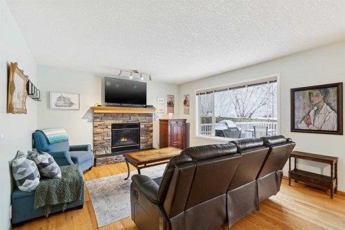 304 Mt. Brewster Circle Se, Calgary, AB - Indoor Photo Showing Living Room With Fireplace