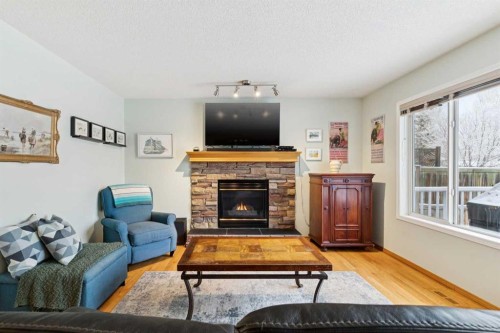 304 Mt. Brewster Circle Se, Calgary, AB - Indoor Photo Showing Living Room With Fireplace