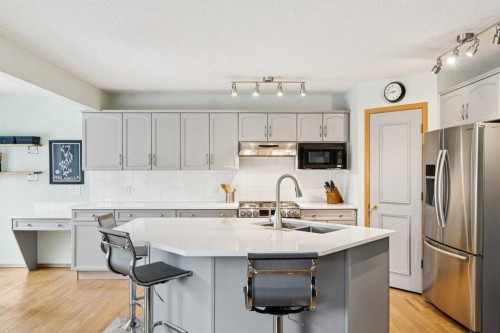 304 Mt. Brewster Circle Se, Calgary, AB - Indoor Photo Showing Kitchen With Double Sink With Upgraded Kitchen