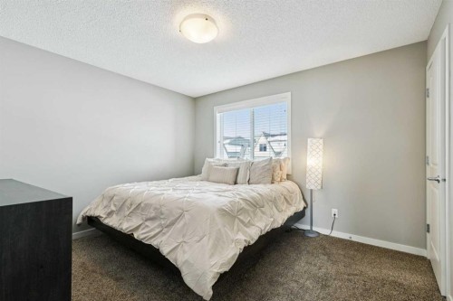50 Fireside Circle, Cochrane, AB - Indoor Photo Showing Bedroom