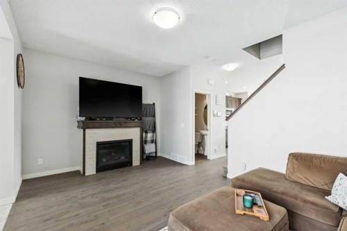 50 Fireside Circle, Cochrane, AB - Indoor Photo Showing Living Room With Fireplace