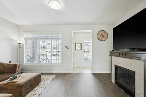 50 Fireside Circle, Cochrane, AB - Indoor Photo Showing Living Room With Fireplace
