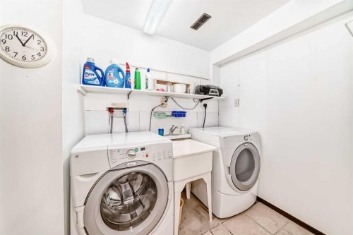 15 Whitewood Bay Ne, Calgary, AB - Indoor Photo Showing Laundry Room