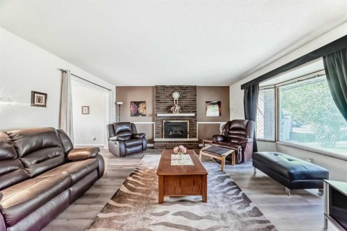 15 Whitewood Bay Ne, Calgary, AB - Indoor Photo Showing Living Room With Fireplace