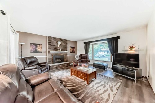 15 Whitewood Bay Ne, Calgary, AB - Indoor Photo Showing Living Room With Fireplace