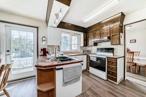 15 Whitewood Bay Ne, Calgary, AB - Indoor Photo Showing Kitchen With Double Sink