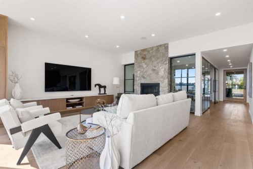 692 West Chestermere Drive, Chestermere, AB - Indoor Photo Showing Living Room With Fireplace