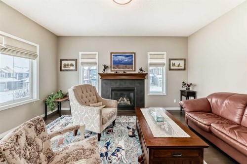 266 Fireside Place, Cochrane, AB - Indoor Photo Showing Living Room With Fireplace