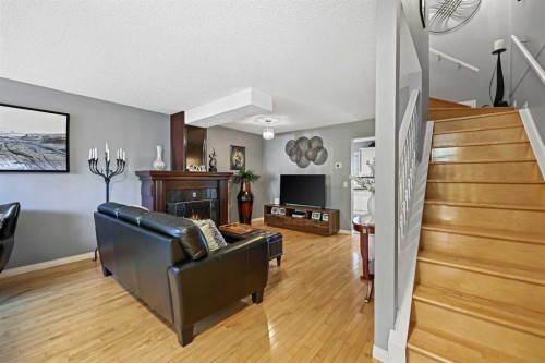 64 Abbeydale Villas Ne, Calgary, AB - Indoor With Fireplace