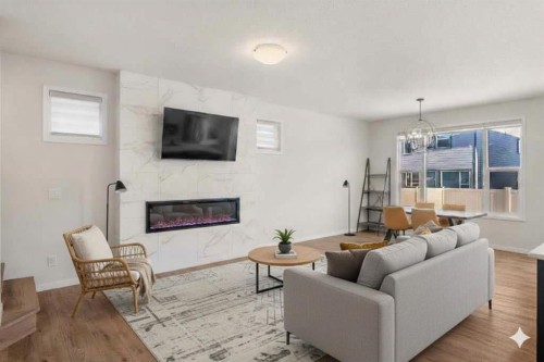 40 West Grove Link Sw, Calgary, AB - Indoor Photo Showing Living Room With Fireplace