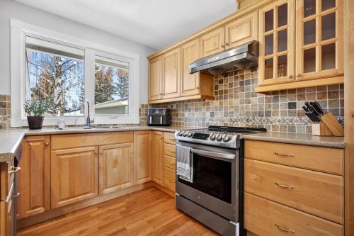 154 Windermere Road Sw, Calgary, AB - Indoor Photo Showing Kitchen With Double Sink