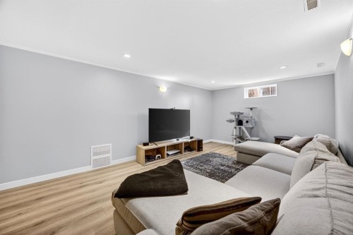 154 Windermere Road Sw, Calgary, AB - Indoor Photo Showing Living Room