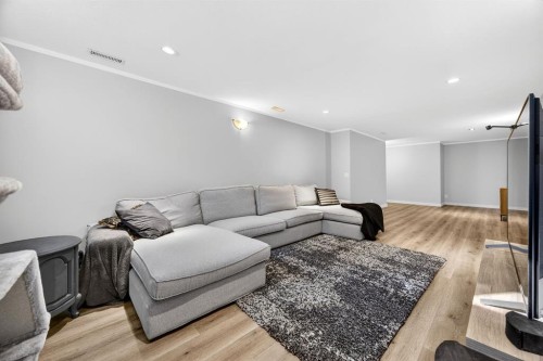 154 Windermere Road Sw, Calgary, AB - Indoor Photo Showing Living Room