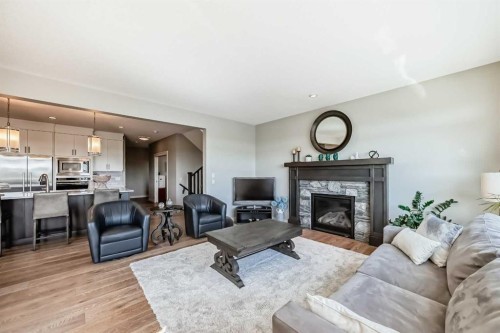 239 Stonemere Green, Chestermere, AB - Indoor Photo Showing Living Room With Fireplace