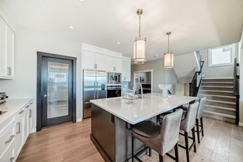 239 Stonemere Green, Chestermere, AB - Indoor Photo Showing Kitchen With Stainless Steel Kitchen With Upgraded Kitchen