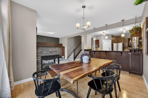 232 Mahogany Terrace Se, Calgary, AB - Indoor Photo Showing Dining Room With Fireplace