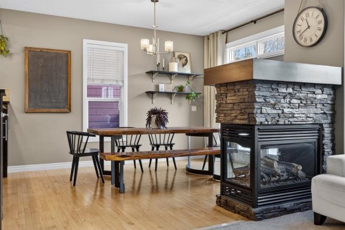 232 Mahogany Terrace Se, Calgary, AB - Indoor Photo Showing Dining Room With Fireplace