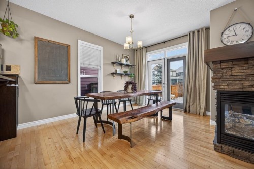 232 Mahogany Terrace Se, Calgary, AB - Indoor Photo Showing Dining Room With Fireplace