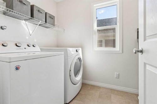 58 Buckskin Way, Cochrane, AB - Indoor Photo Showing Laundry Room