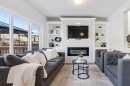 58 Buckskin Way, Cochrane, AB  - Indoor Photo Showing Living Room With Fireplace 