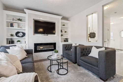 58 Buckskin Way, Cochrane, AB - Indoor Photo Showing Living Room With Fireplace