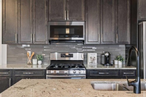 58 Buckskin Way, Cochrane, AB - Indoor Photo Showing Kitchen With Double Sink With Upgraded Kitchen