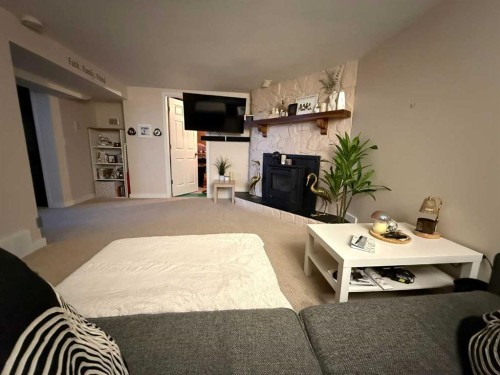 37 Arbour Crescent Se, Calgary, AB - Indoor With Fireplace