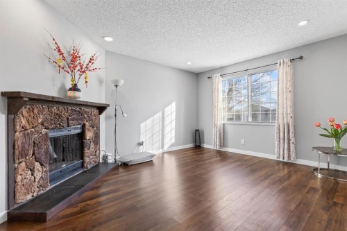 392 Templeside Circle Ne, Calgary, AB - Indoor Photo Showing Living Room With Fireplace