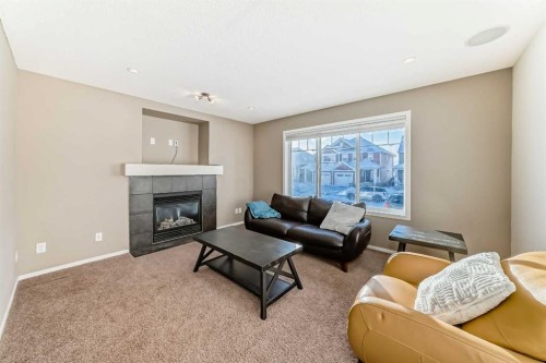 145 River Heights Crescent, Cochrane, AB - Indoor Photo Showing Living Room With Fireplace