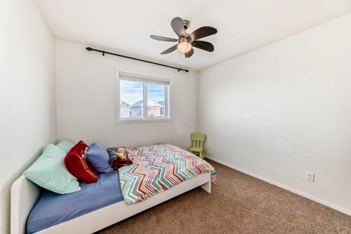 145 River Heights Crescent, Cochrane, AB - Indoor Photo Showing Bedroom