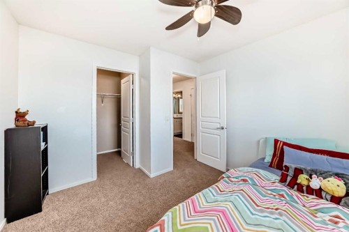 145 River Heights Crescent, Cochrane, AB - Indoor Photo Showing Bedroom