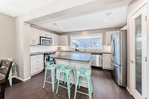145 River Heights Crescent, Cochrane, AB - Indoor Photo Showing Kitchen With Stainless Steel Kitchen