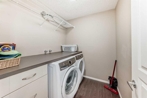 145 River Heights Crescent, Cochrane, AB - Indoor Photo Showing Laundry Room