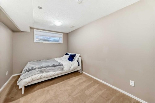 145 River Heights Crescent, Cochrane, AB - Indoor Photo Showing Bedroom