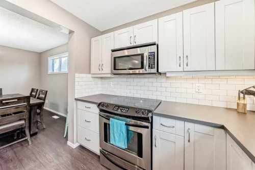 145 River Heights Crescent, Cochrane, AB - Indoor Photo Showing Kitchen