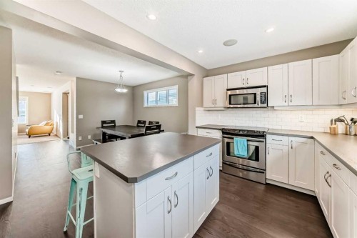145 River Heights Crescent, Cochrane, AB - Indoor Photo Showing Kitchen With Stainless Steel Kitchen