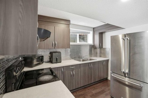 113 Mt Lorette Place Se, Calgary, AB - Indoor Photo Showing Kitchen With Double Sink With Upgraded Kitchen