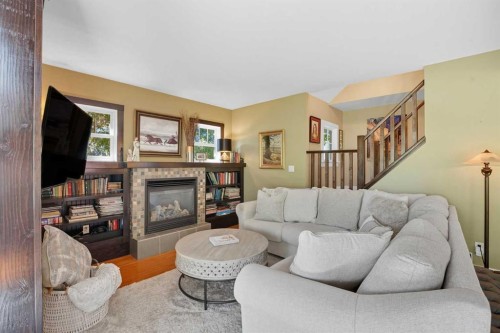 602 Macleod Trail Sw, High River, AB - Indoor Photo Showing Living Room With Fireplace