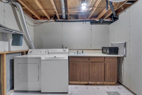 36 Falton Court Ne, Calgary, AB - Indoor Photo Showing Laundry Room