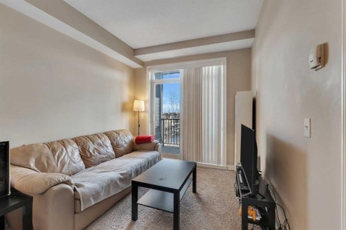 312-117 Copperpond Common Se, Calgary, AB - Indoor Photo Showing Living Room