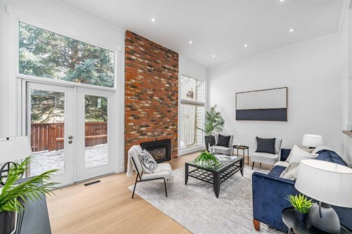 357 Point Mckay Gardens Nw, Calgary, AB - Indoor Photo Showing Living Room With Fireplace