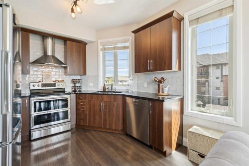 2302-15 Sunset Square, Cochrane, AB - Indoor Photo Showing Kitchen