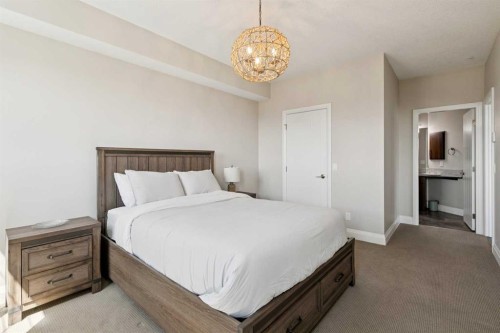2302-15 Sunset Square, Cochrane, AB - Indoor Photo Showing Bedroom