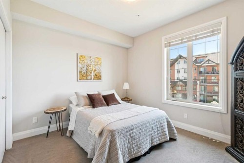 2302-15 Sunset Square, Cochrane, AB - Indoor Photo Showing Bedroom
